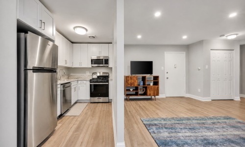 a kitchen with white cabinets